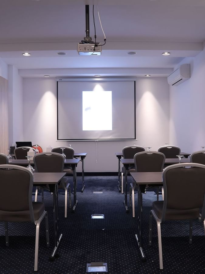 Classroom set-up facing the projector screen in 7th Ciel meeting room at Warwick Palm Beach Hotel