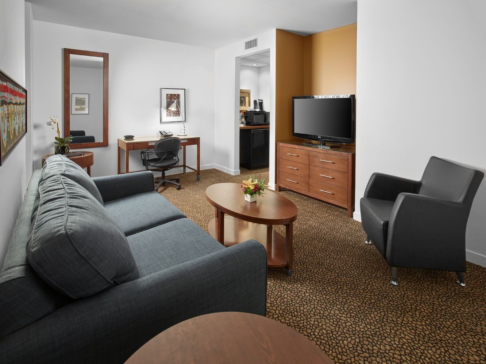 Studio living room area with a TV at Metterra Hotel on Whyte