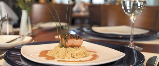 Salmon on a bed of rice meal served on the table at Poets Cove Resort & Spa