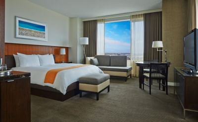 a tv facing a bed in a hotel room