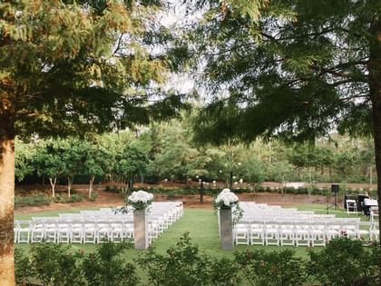 Outdoor wedding ceremony in Western Lake Park at WaterColor Inn