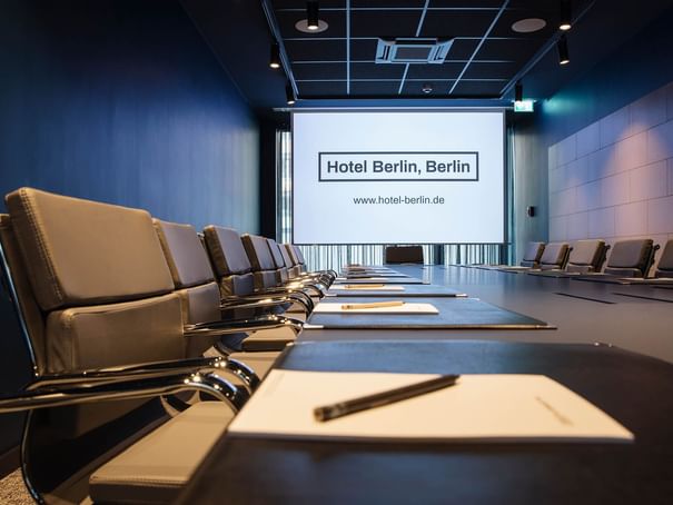 Stationery setup in Meeting Room B4 at Hotel Berlin Berlin