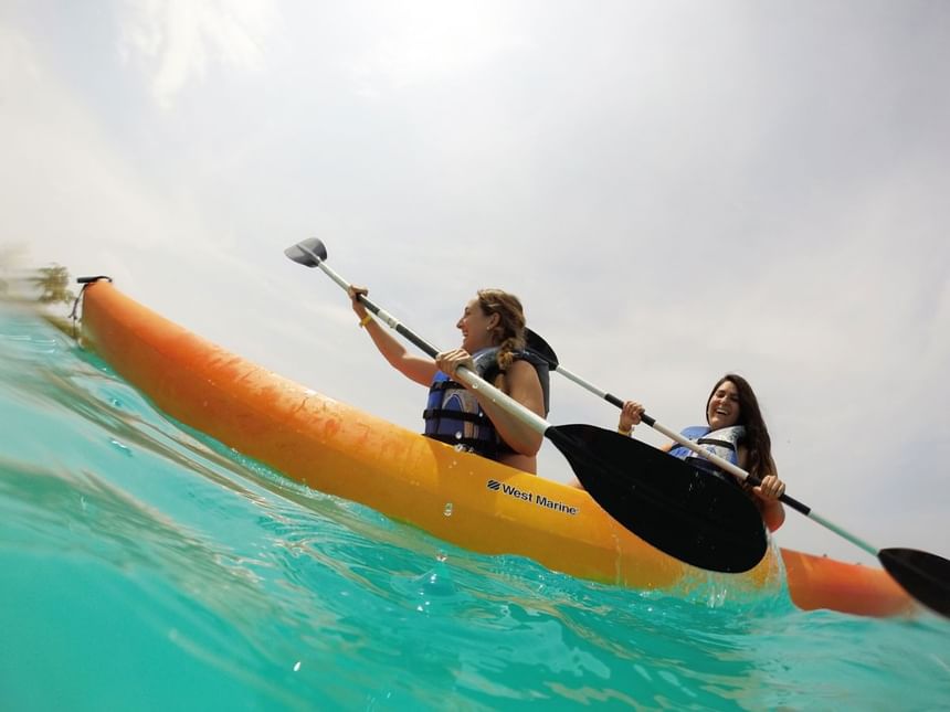 Two girls on a kayak ride at Playa Blanca Pool