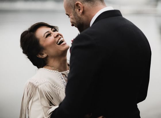 A couple laughing at their wedding at Alderbrook Resort & Spa