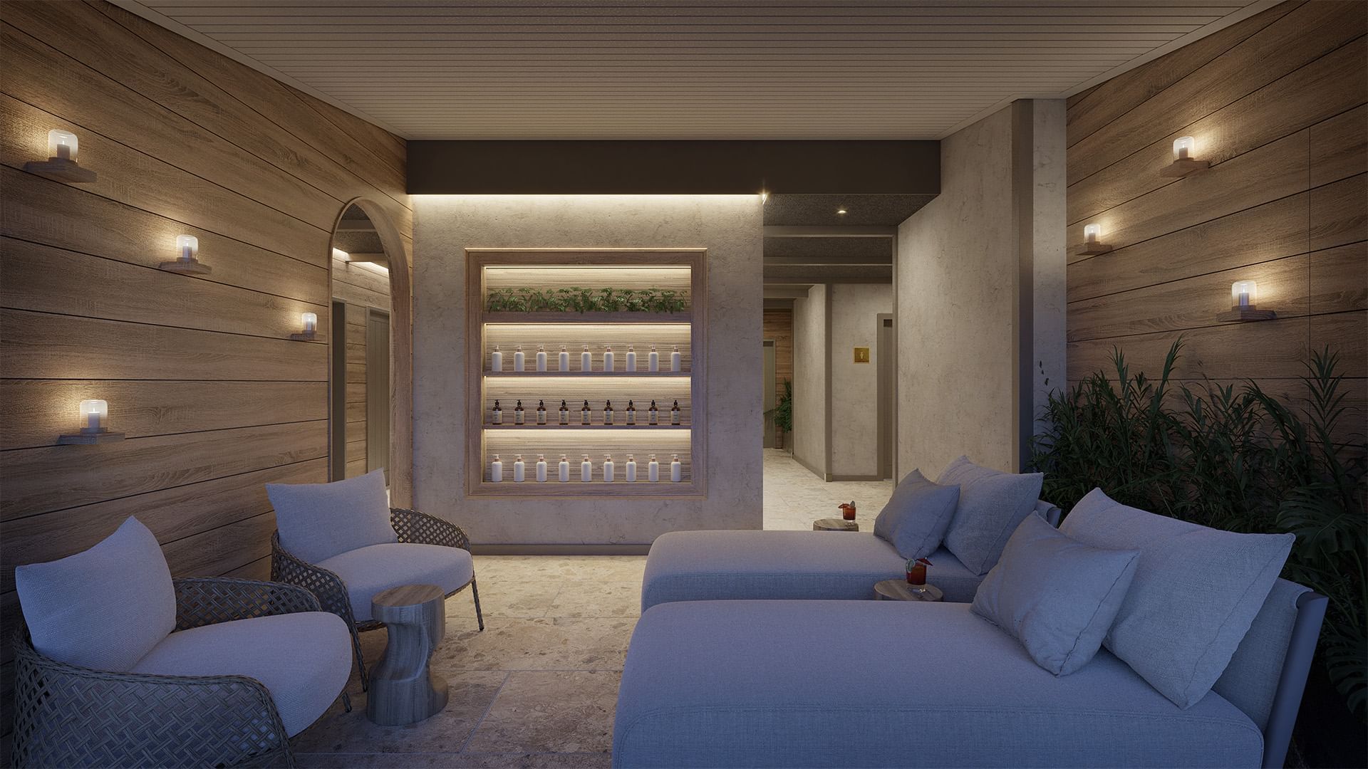 Lounge area with armchairs, and an illuminated shelf with plants and bottles in Spa at Dunluce Lodge