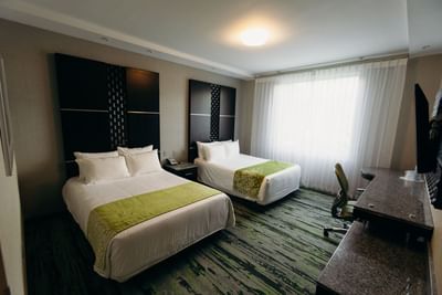 2 double beds & work desk in a Standard Room at Araiza San Luis