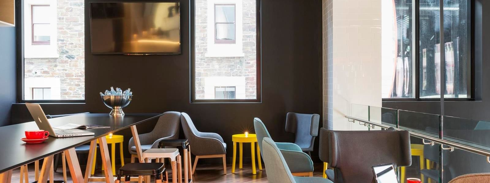 Comfortable tables and chairs of high bar at Ibis Adelaide 