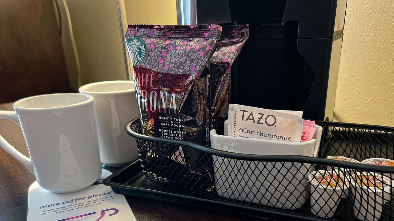 Tea, coffee, mugs, and coffee machine