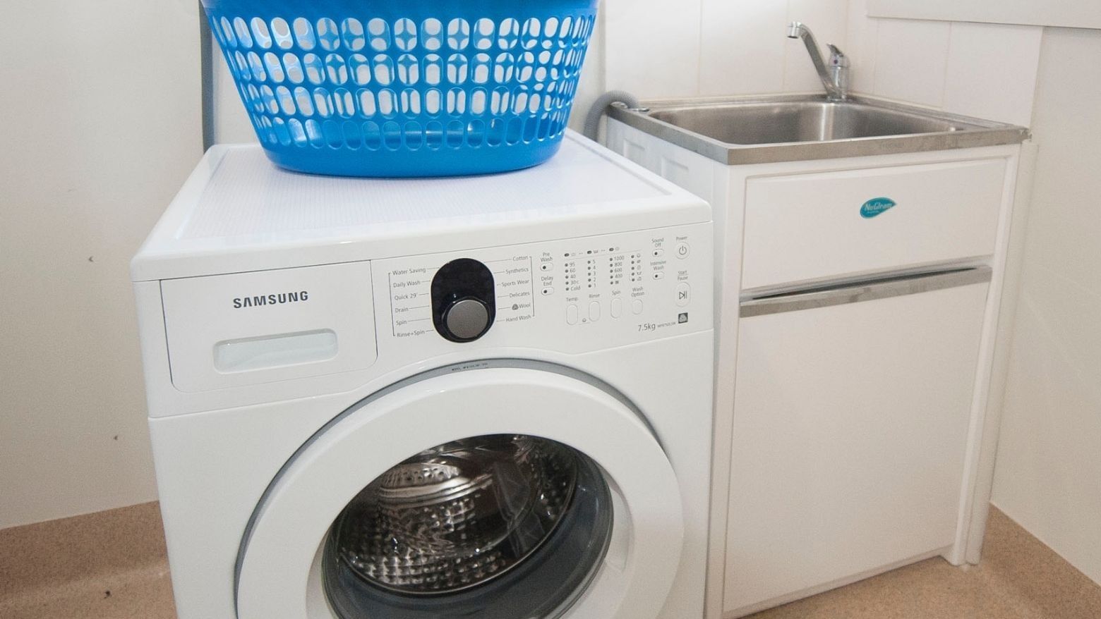 Samsung washing machine with blue basket on top at La Trobe University Regional Housing Shepparton.