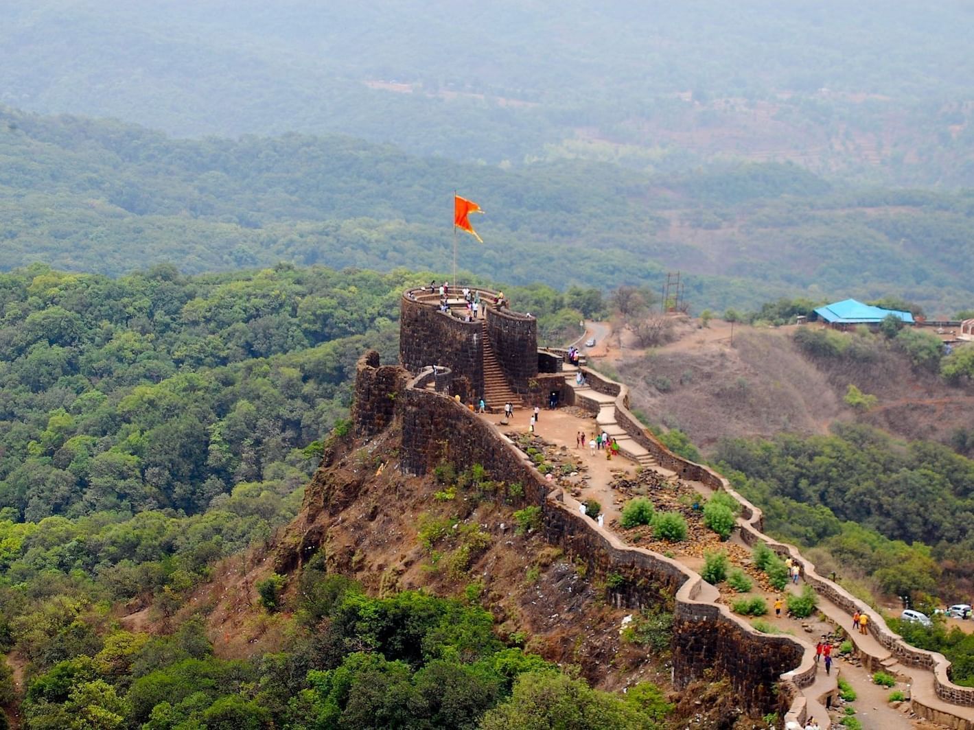 Aerial view of people exploring Pratapgad Fort near Eastin Easy Vita