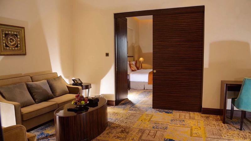 Living room with couches & carpeted floors in Business Suite at Warwick Al Khobar