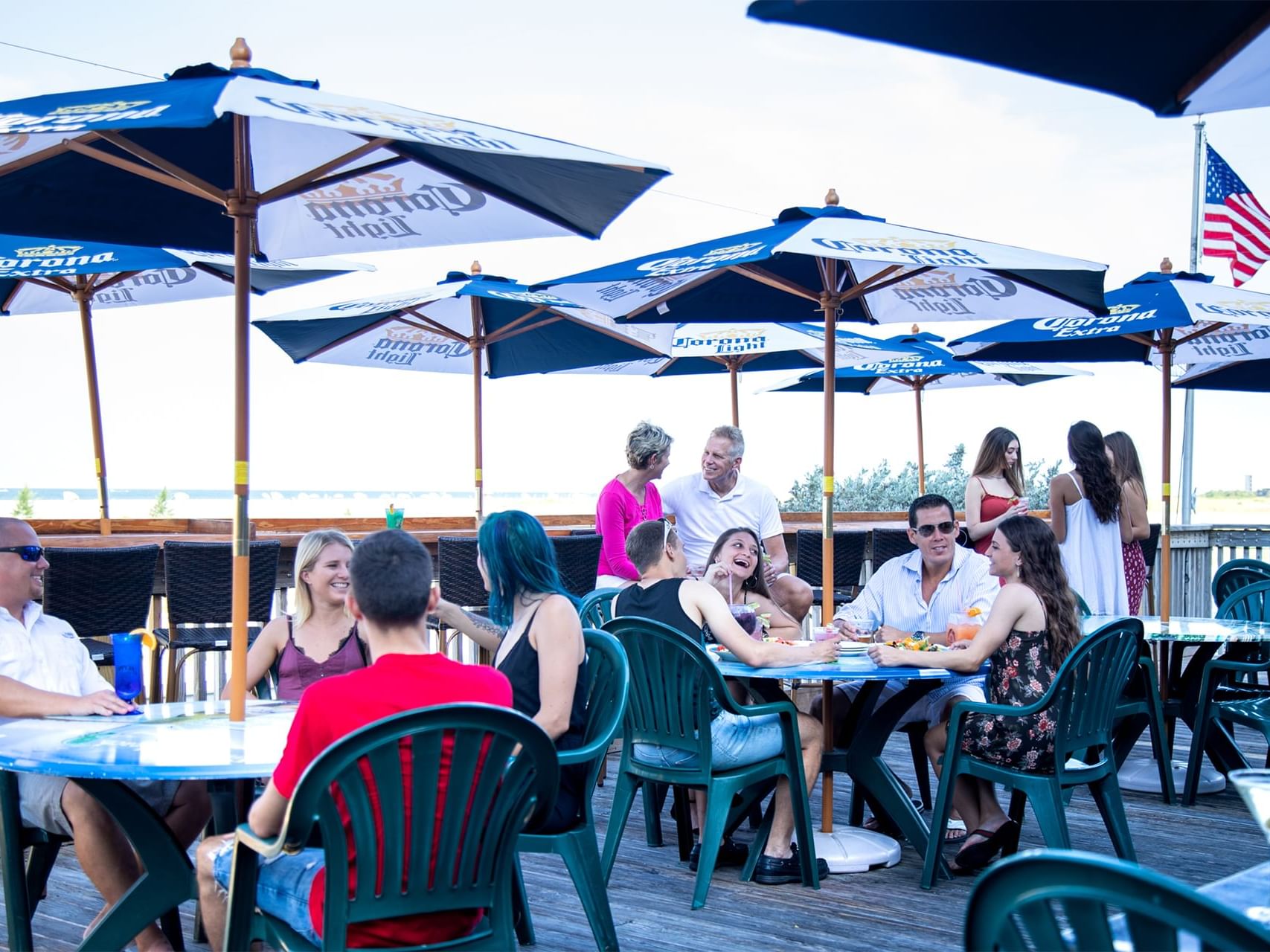 people sitting under covered tables outside