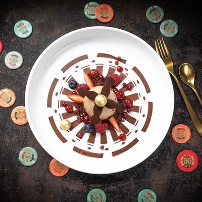 Plate of an assortment of chocolate pieces, featuring JRE Chef Roulette event at Falkensteiner Schlosshotel Velden
