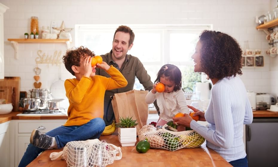 A family enjoying in the kitchen at Legacy Vacation Resorts