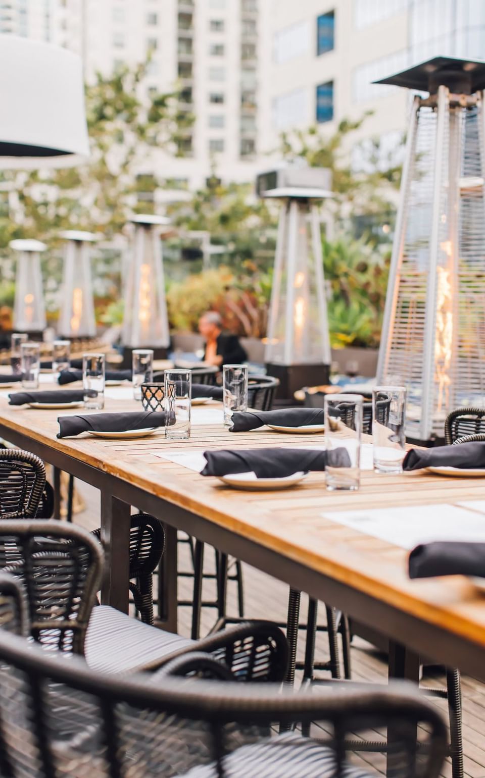 Torch Heaters by the tables in Topside Terrace Kitchen & Bar at Hotel Republic San Diego