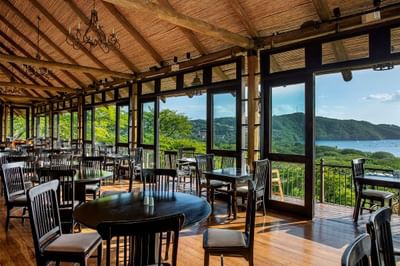 Dining area overlooking the outdoors from Bahía Restaurant at Villas Sol Beach Resort