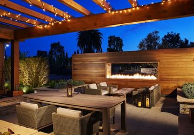 Couches, chairs & fireplace on the patio at The Nest Palo Alto