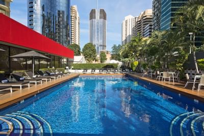 Outdoor pool with city view at Royal on the Park Hotel