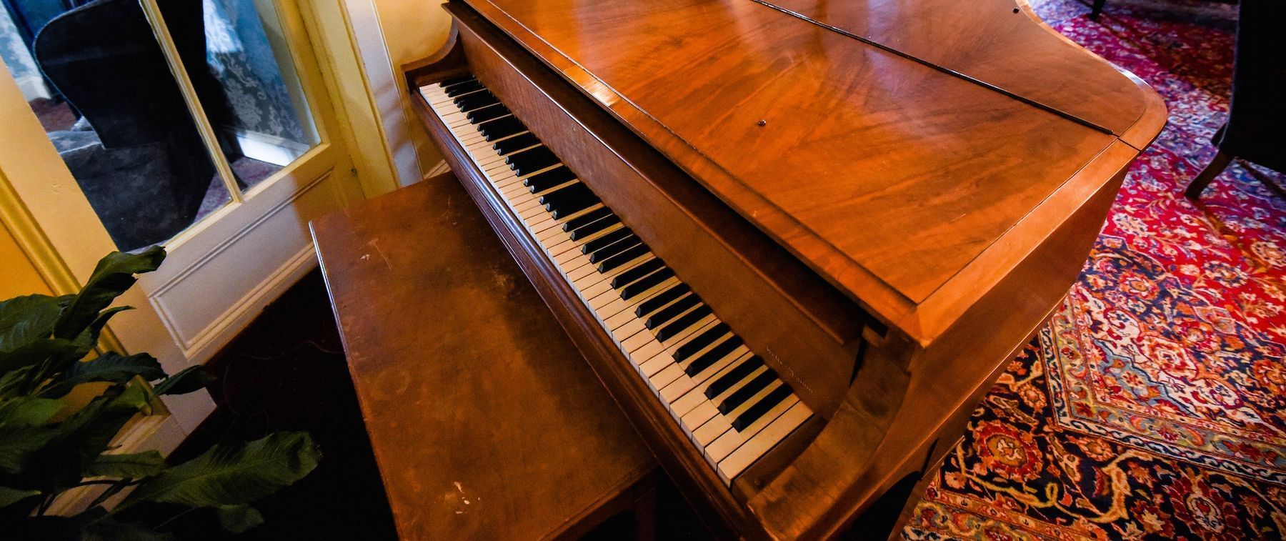 Closeup of a grand piano in the Ballroom at The Inn Saratoga