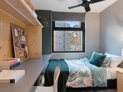 La Trobe University - North and South Apartments bedroom with desk and bed.