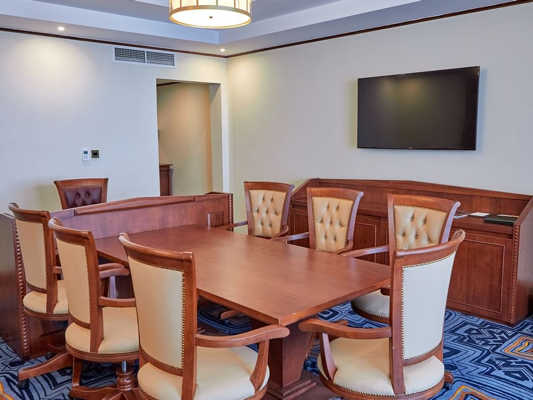 Table setup & Tv in Presidential Suite at Goma Serena Hotel