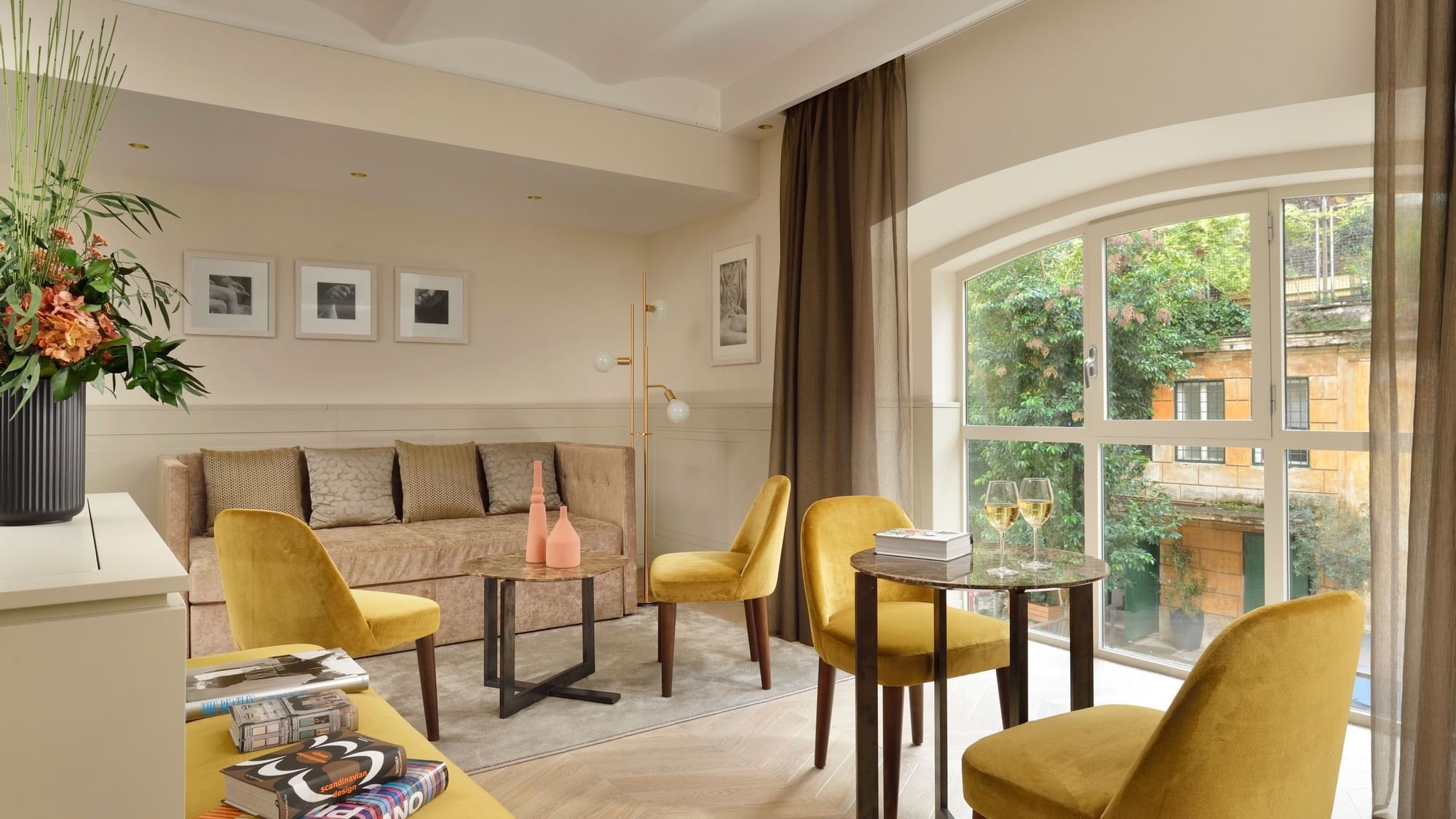 Cozy seatings arranged by the window in the living area of Studio Suite at Margutta 54