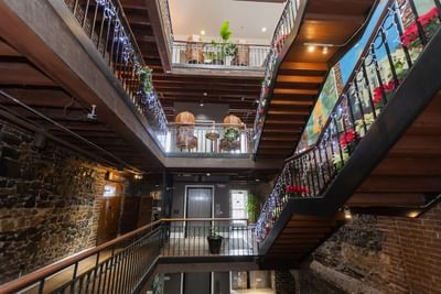 Staircase featuring floral arrangements & decorations at River Street Inn