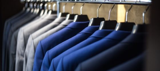 Closeup on Blazers hanging in a wardrobe at Vasa Hotel Surabaya