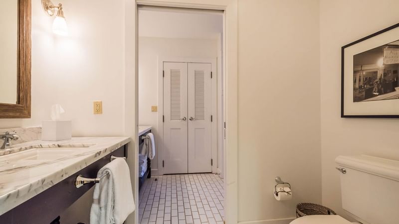 Bathroom lavatory by the marbled vanity area in Resort suite at Watersound Inn