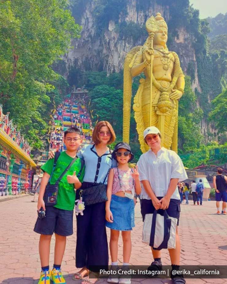 Family posing near Batu Caves, an iconic attraction near Imperial Lexis Kuala Lumpur