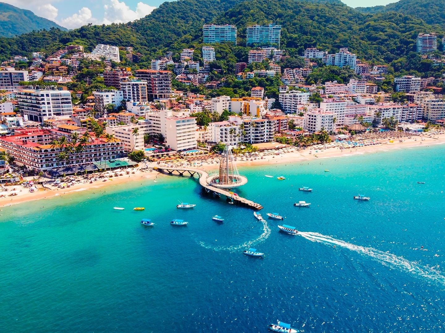 Aerial view of Los Muertos Pier with city near Plaza Pelicanos Club Beach Resort