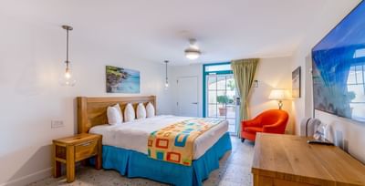 Cozy bedroom featuring a king bed with an outdoor view in Superior Studio at Amsterdam Manor Beach Resort