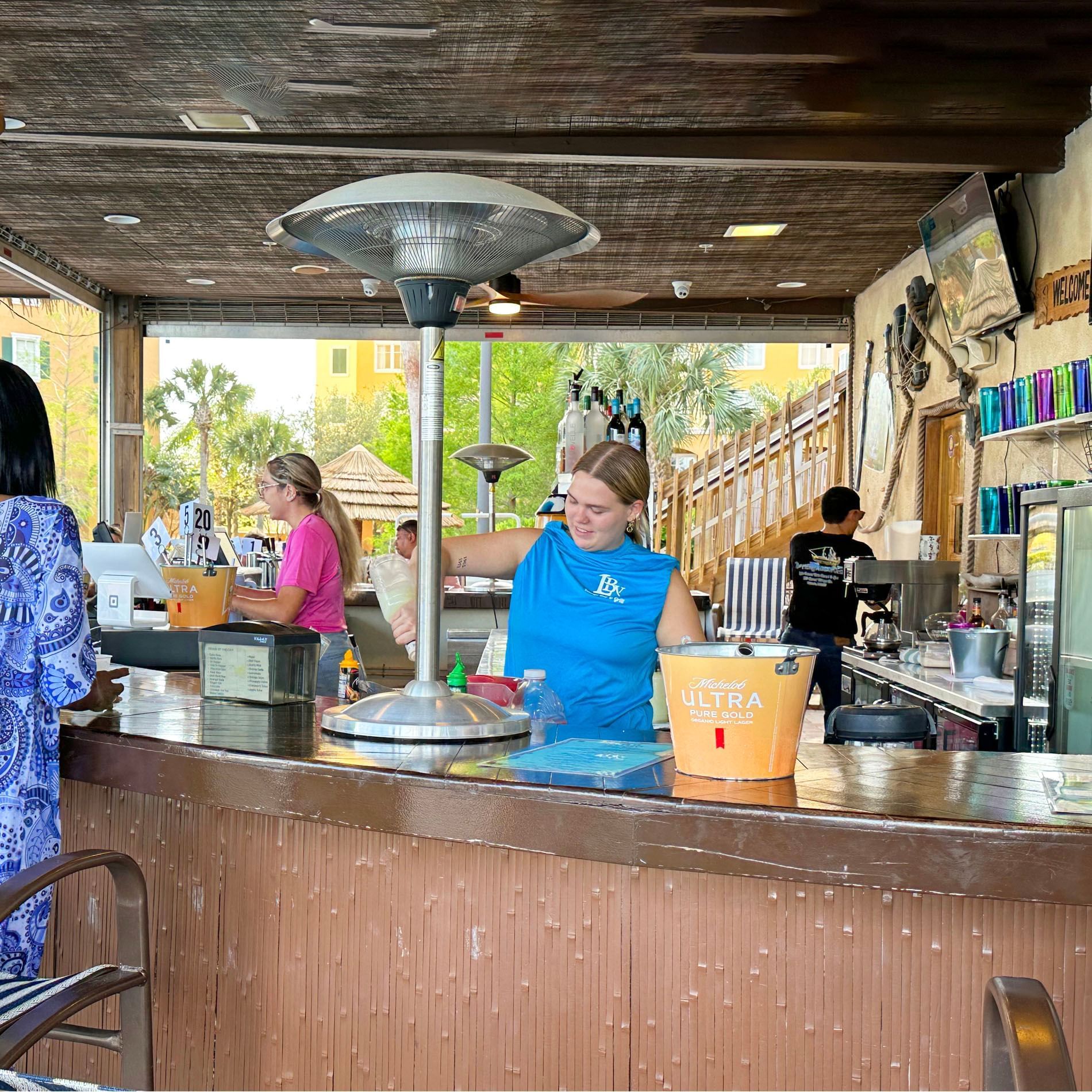 Bartenders and work area in LBV Village Bar & Grill at Lake Buena Vista Resort Village & Spa