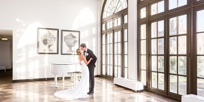 Newlyweds in Palm Court of the Berkeley