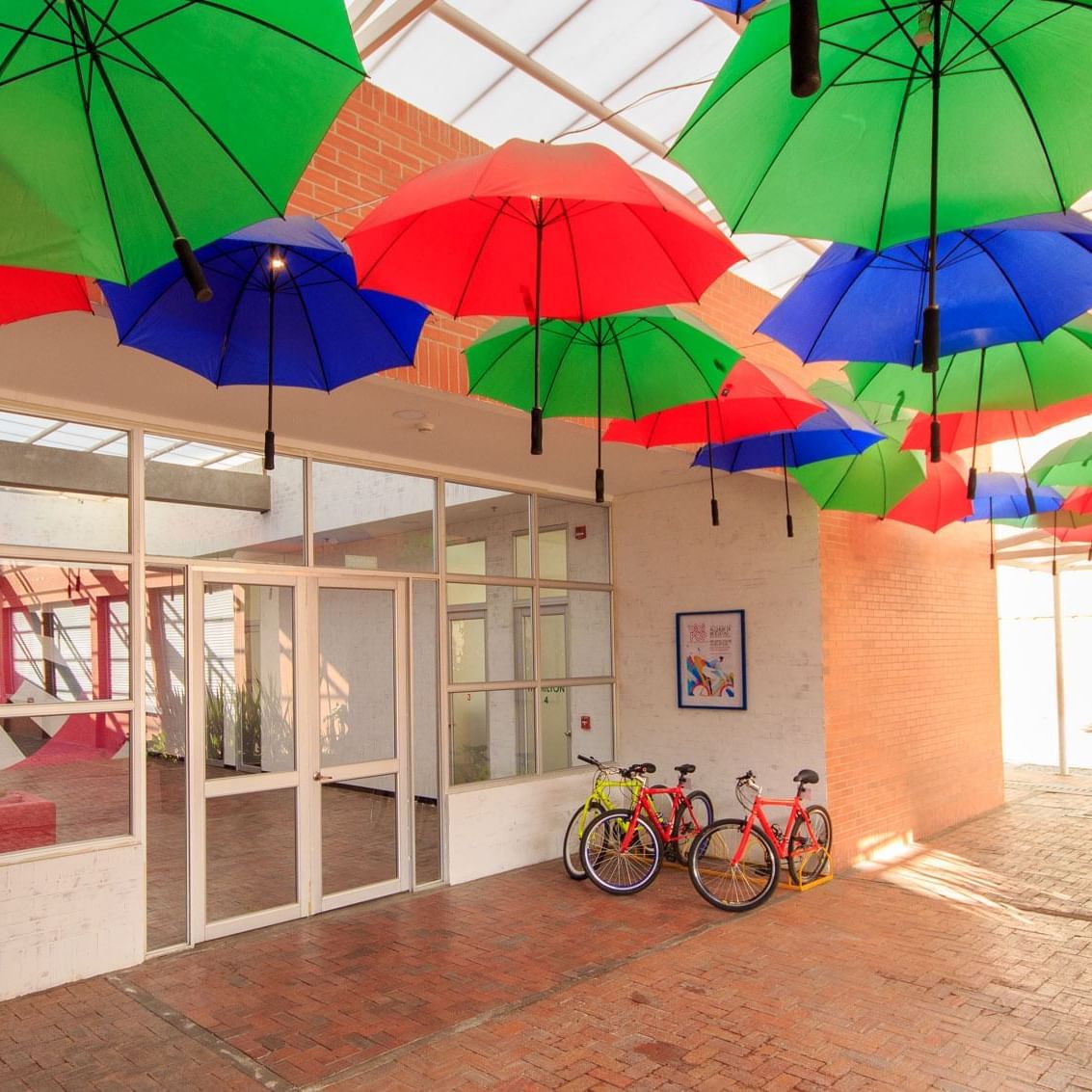 Space with umbrellas hang on the ceiling at Pop Art Tocancipa