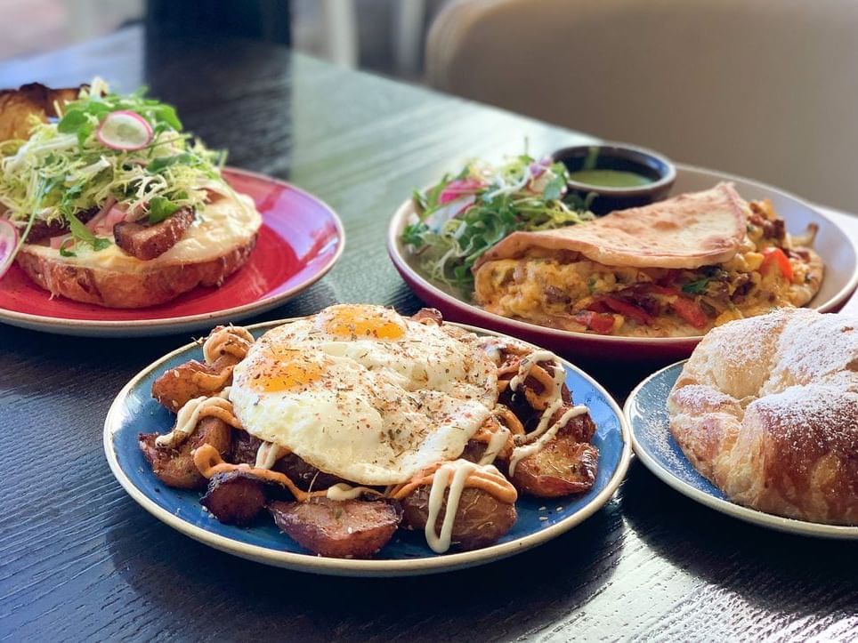 Closeup on some dishes served in Convivo at Santa Barbara Inn