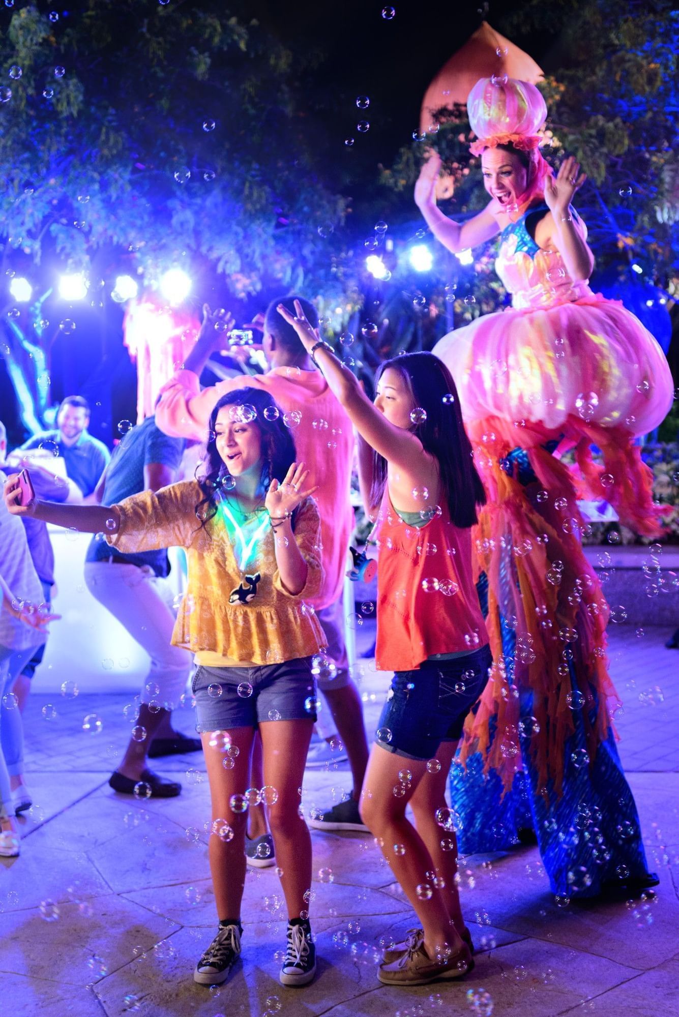 Parkgoers dance at Electric Ocean, a dance party at the SeaWorld Summer Spectacular in Orlando