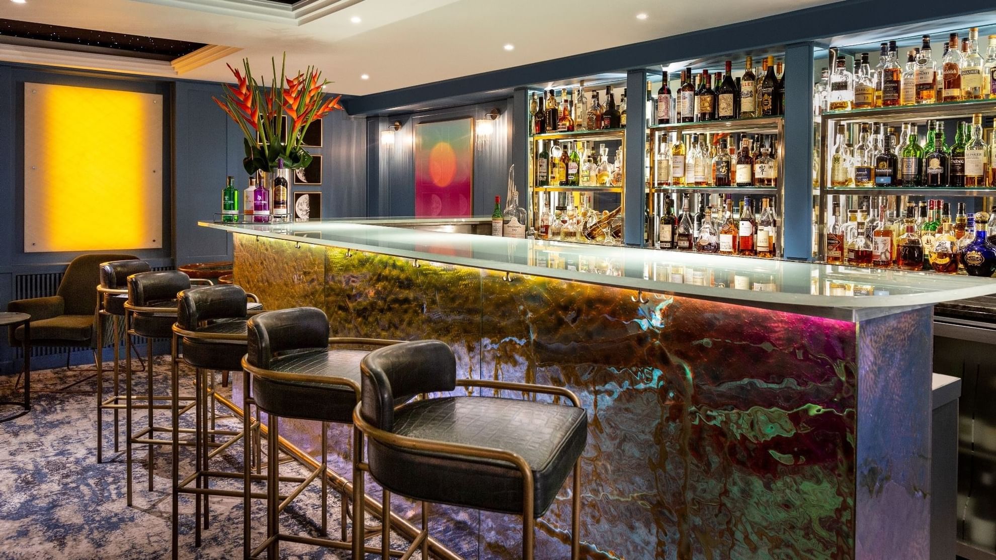 Bar counter with botels of shelves in The Restaurant at The Capital