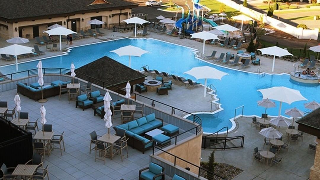 Aerial view of the Rooftop patio surrounded by lounge chairs at Shangri-La Monkey Island
