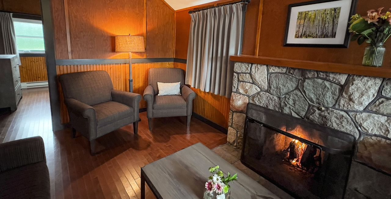 Fireplace and sitting area inside of a cabin