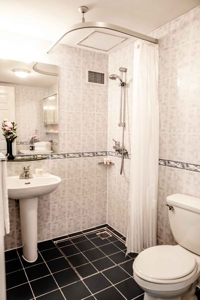 Bathroom vanity with a shower curtain at Hanoi Daewoo Hotel