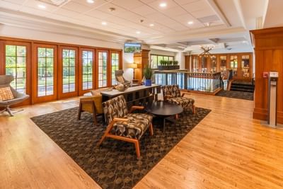 Cozy lounge with a variety of seating and large French doors at The Boulevard Inn & Bistro