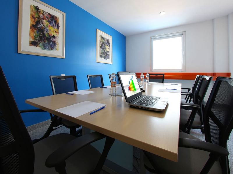 Conference table with a laptop in a Meeting Room at One Hotels