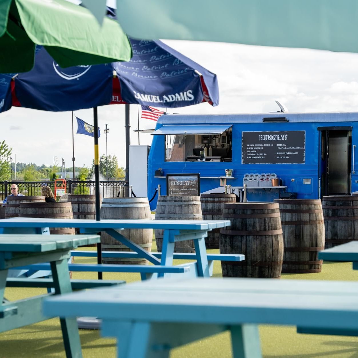 Tables arranged by the food truck in Beer Garden at The Artisan Hotel at Tuscan Village