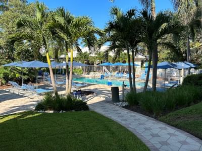 Pathway to the outdoor pool area at Trianon Bonita Bay