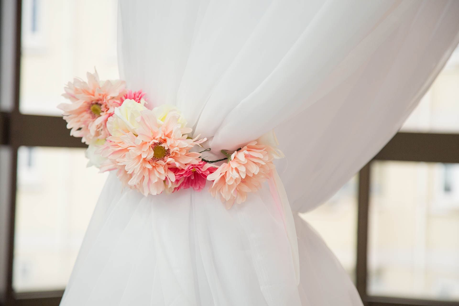Curtains tied using a floral deco piece at The View
