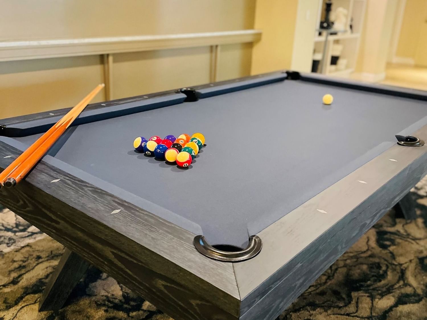 Pool table with pool balls and and pool cue 