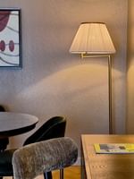 Work desk and dining table in Premium Suite with wooden floors at Warwick Reine Astrid - Lyon