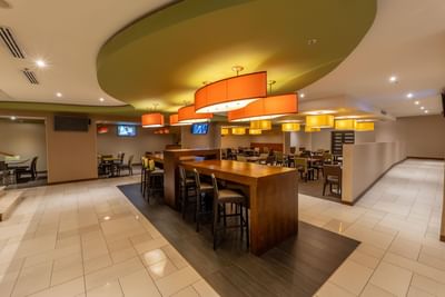 Modern restaurant interior with bar counter at MARlNN Place Financial District, one of the best hotels in Panama City