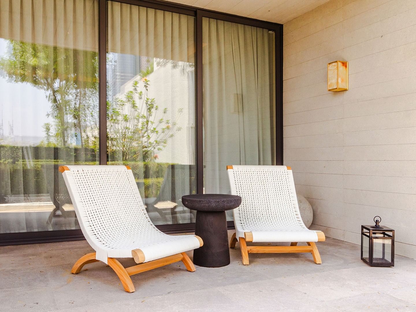 King Superior Viceroys Suite outdoor terrace featuring white lounge chairs and a side table at Camino Real Polanco Mexico